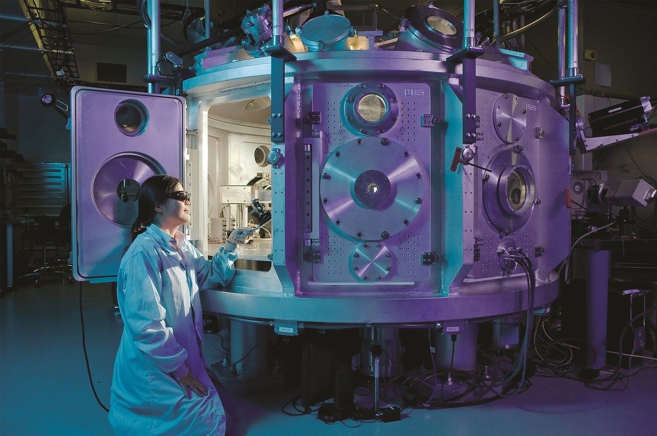 Picture of a woman working on a big machine